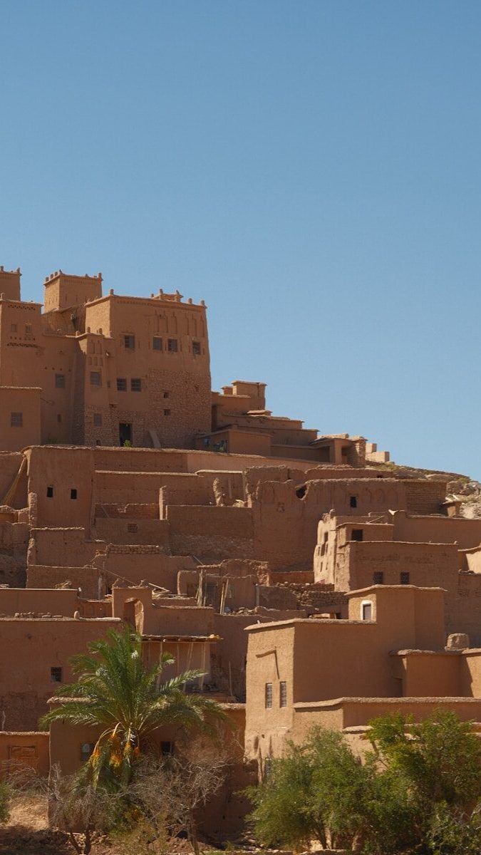 Ancient mud-brick village under a clear blue sky